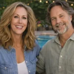 Chris Potoski sitting beside a woman in an indoor portrait setting