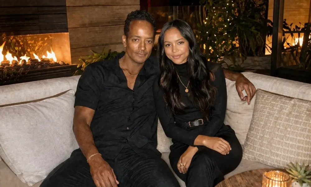 Devon Minters sitting in an elegant indoor lounge with warm lighting