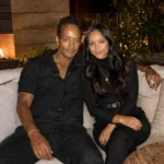 Devon Minters sitting in an elegant indoor lounge with warm lighting