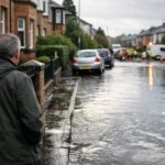 Flooded street in Glasgow after a water mains burst