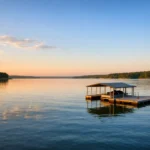 Sunrise view of Lake Texoma with calm water and a dock