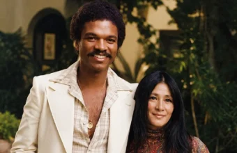 Teruko Nakagami in a vintage-style portrait standing beside a smiling man outdoors